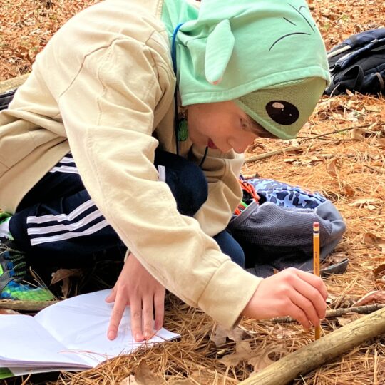 Student demonstrates impact of Muddy Sneakers by applying science to field study.
