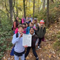 Students demonstrate impact of silent hike by describing observation