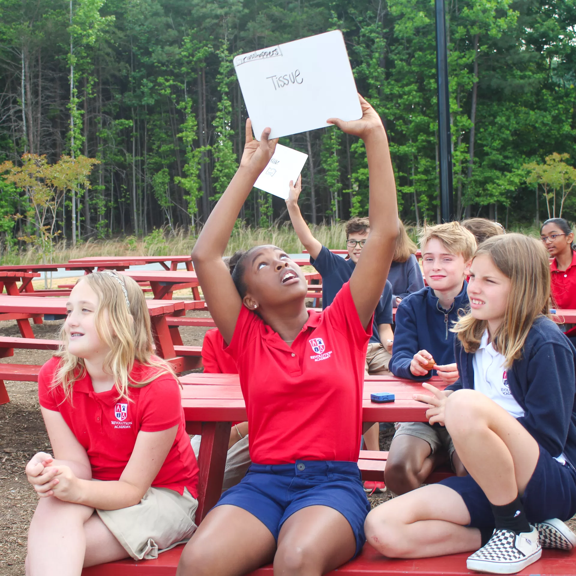 Revolution Academy Students participate in an interactive End of Grade test prep game to review science concepts before EOG testing.