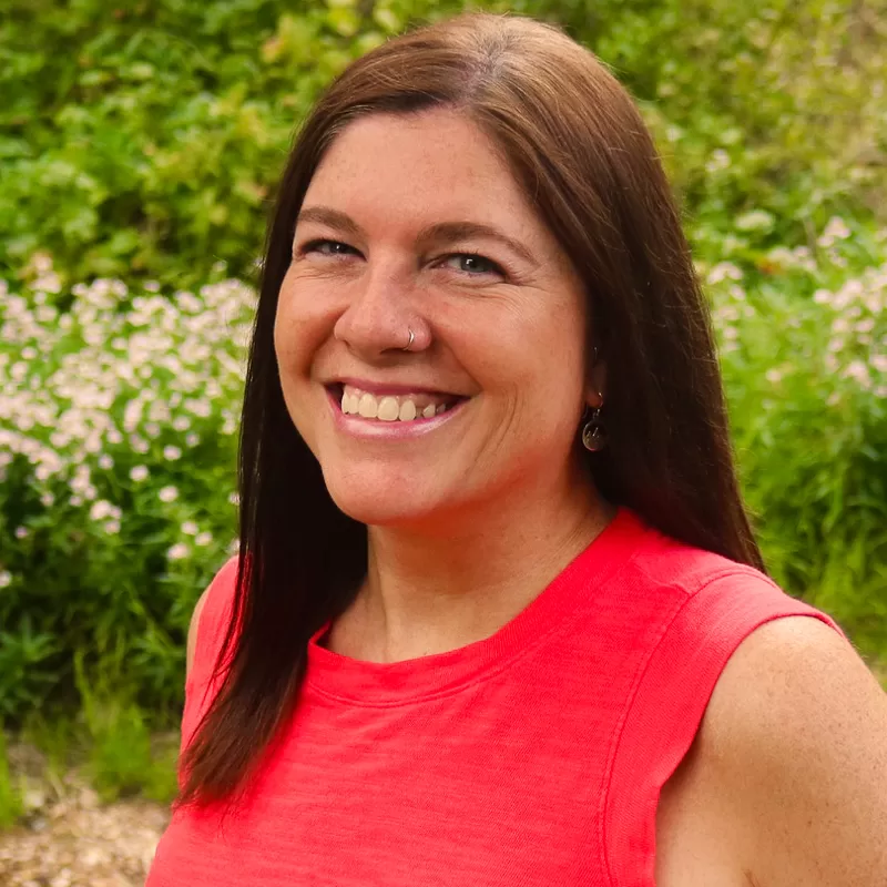 Headshot of Kira King smiling at the camrea