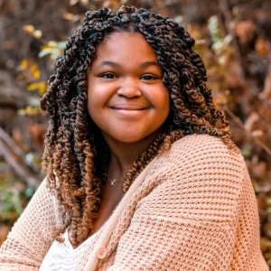 Piedmont Piedmont Programming Manager, Aaliyah Wright smiling at the camera.