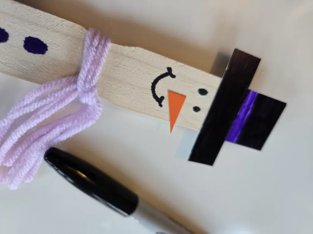 Winter craft: decorate your snow stick