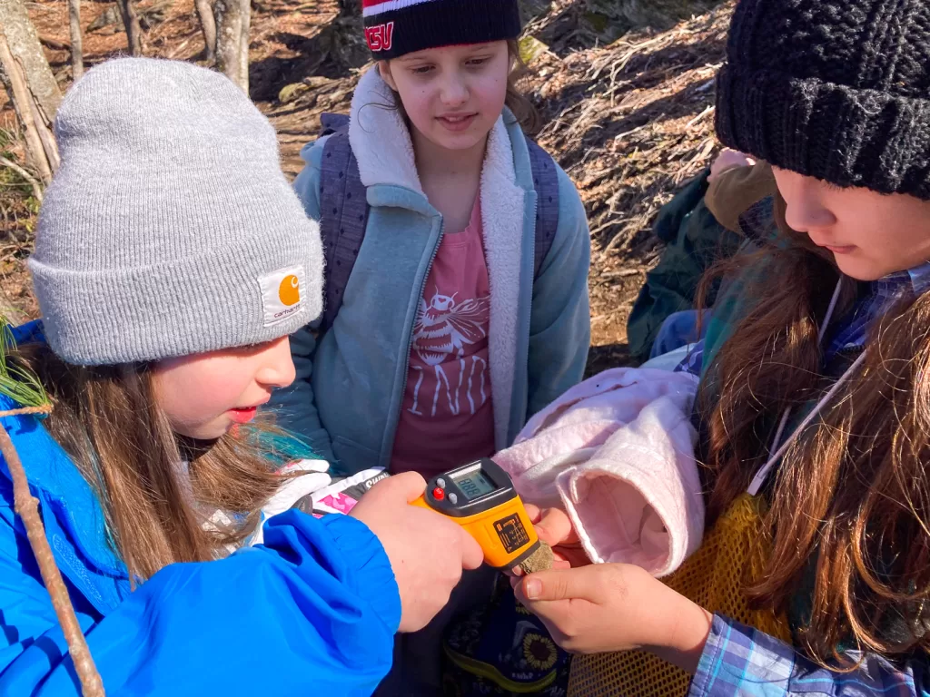 Students learning about heat and energy transfer during a field trip.