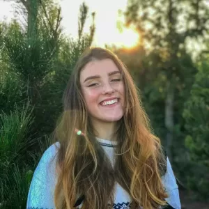 Sienna Rutledge, Muddy Sneakers Field Instructor, smiling at the camera