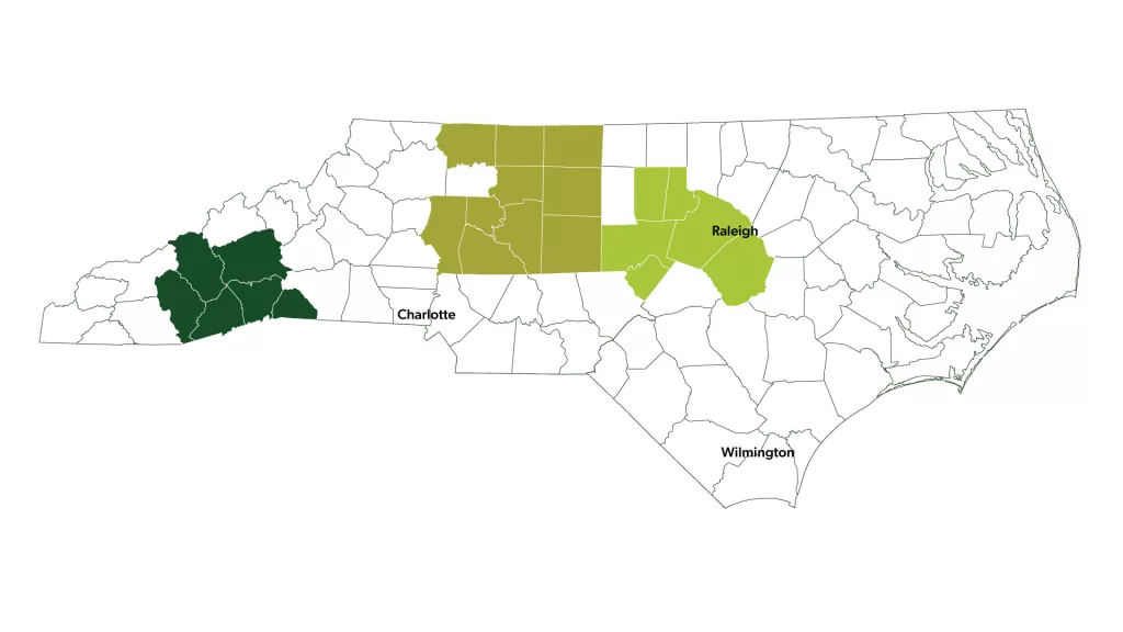 Map of North Carolina with Muddy Sneakers service area highlight, including the following counties: Buncombe, Haywood, Henderson, Jackson, Polk, Transylvania, Davidson, Davie, Forsyth, Guilford, Iredell, Randolph, Rockingham, Rowan, Stokes, Surry, Chatham, Durham, Johnston, Lee, Orange, and Wake.